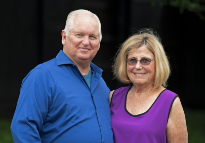 Lee & Susan Searing posing for a camera